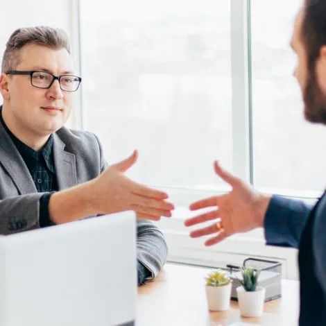 they are giving shake hand after register a company in Qatar